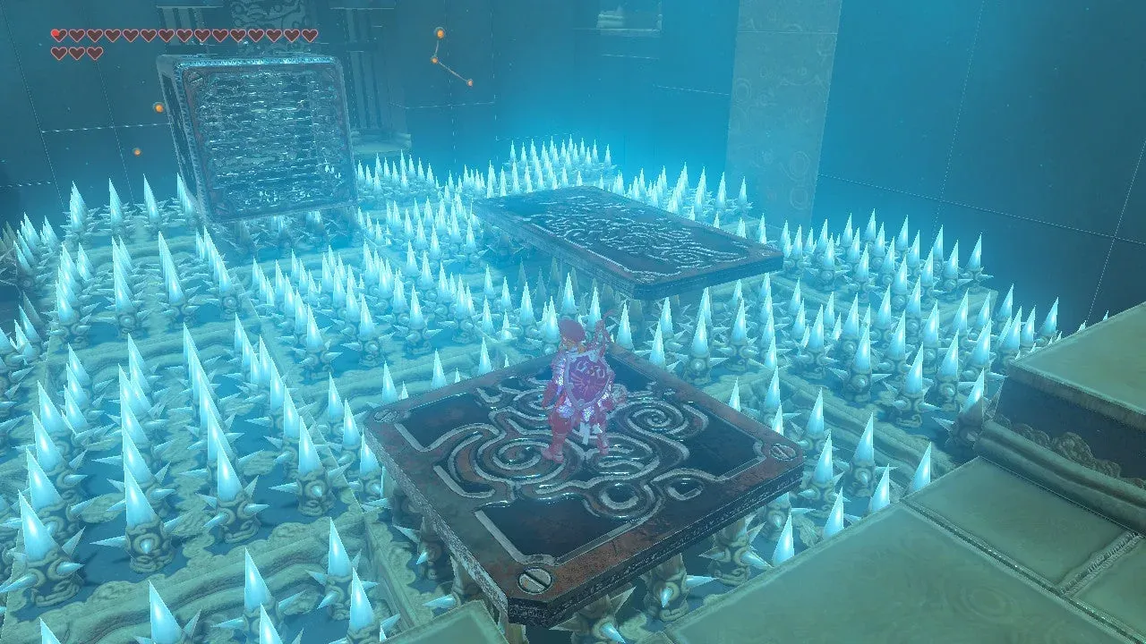 Metal plates and a cube above the first room’s spike floor