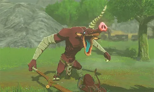 A red Moblin with its mouth wide open lunging toward Link in a grassy field