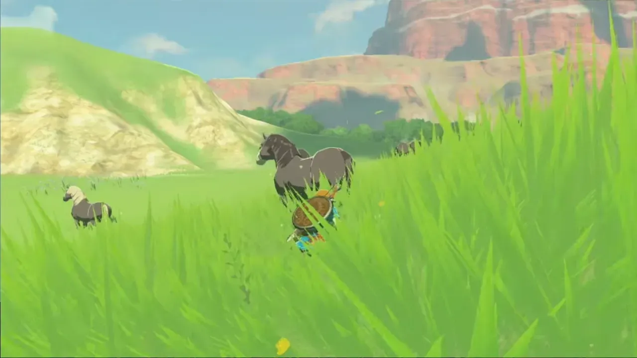 Link crouching in tall grass behind a wild horse