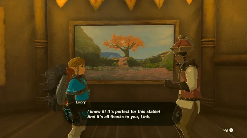 Embry at Outskirt Stable standing next to a framed picture of a tree with orange leaves