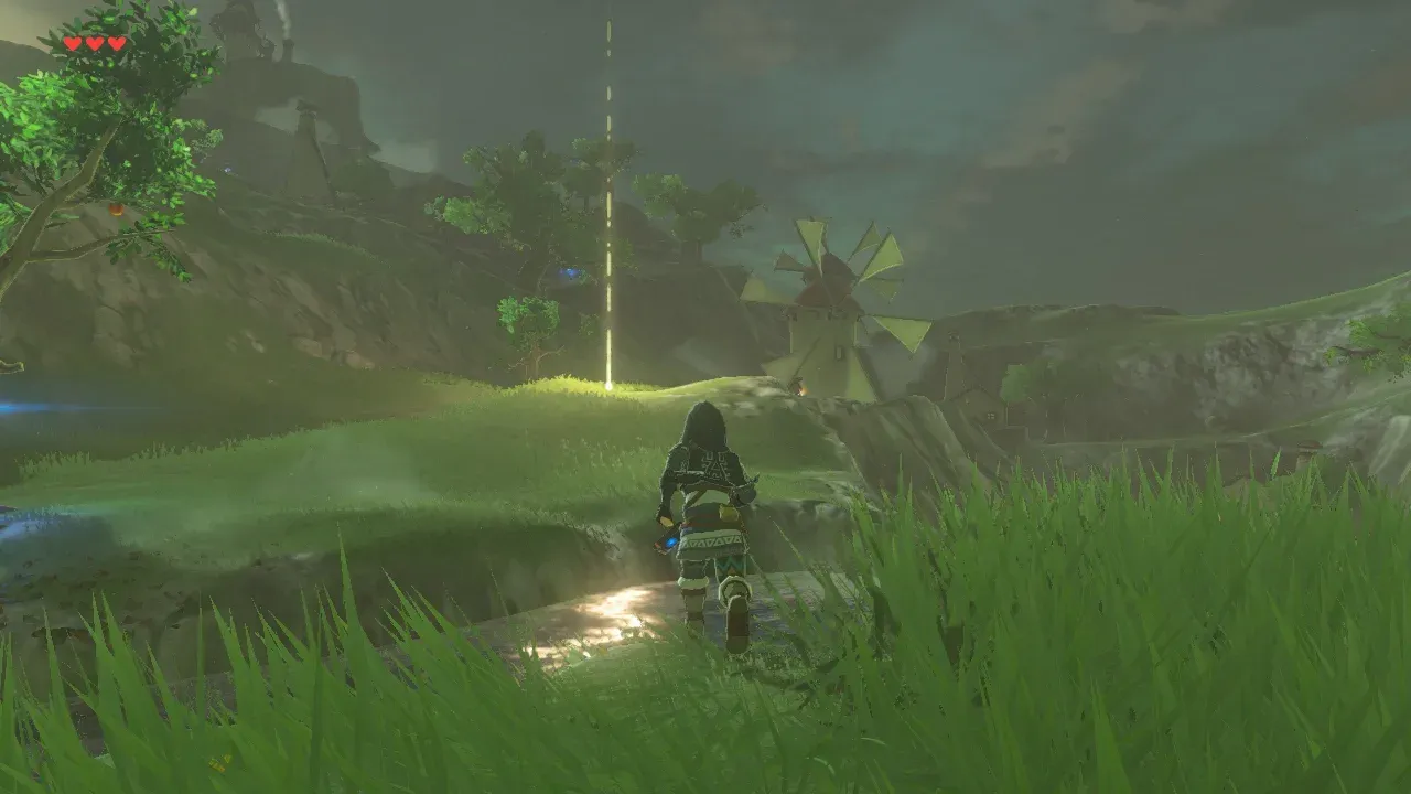 A beam of light on a grassy field at night marking where a Star Fragment fell