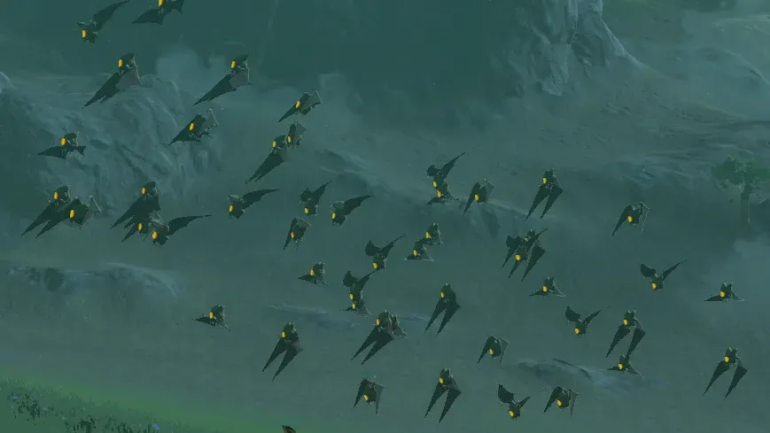 A loose flock of Keese with glowing yellow eyes flying over a grassy slope at night