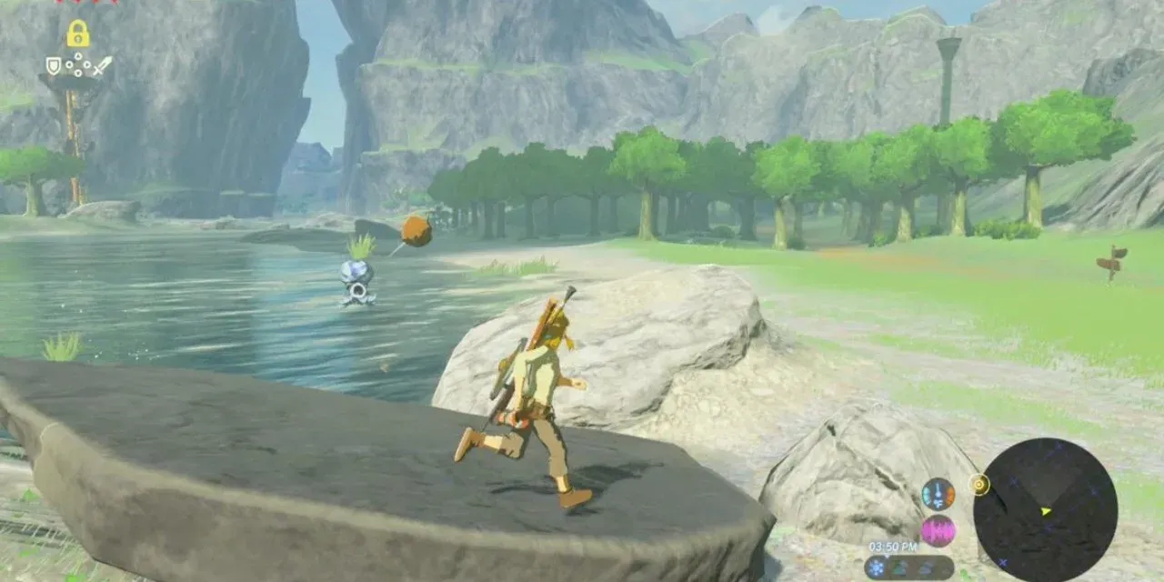 A Water Octorok in a river spitting a rock toward Link on the bank