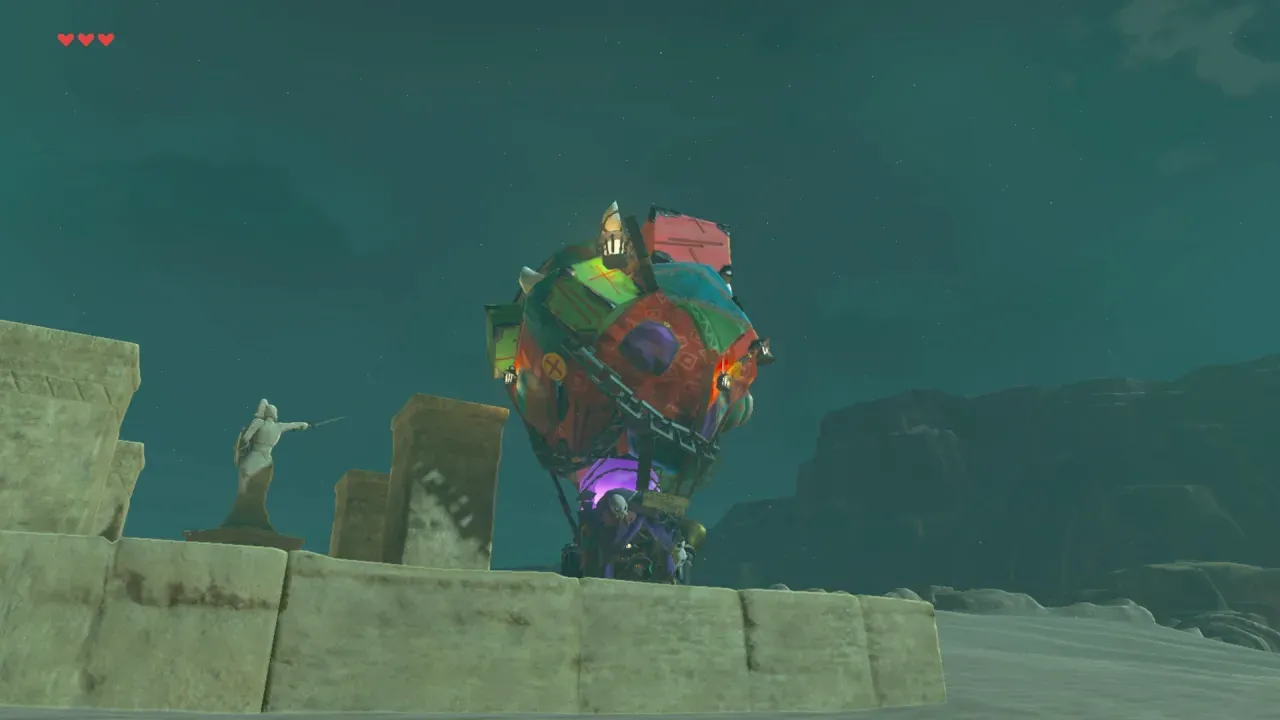 At night, the Fang and Bone cart stands behind a ruined stone wall in the desert